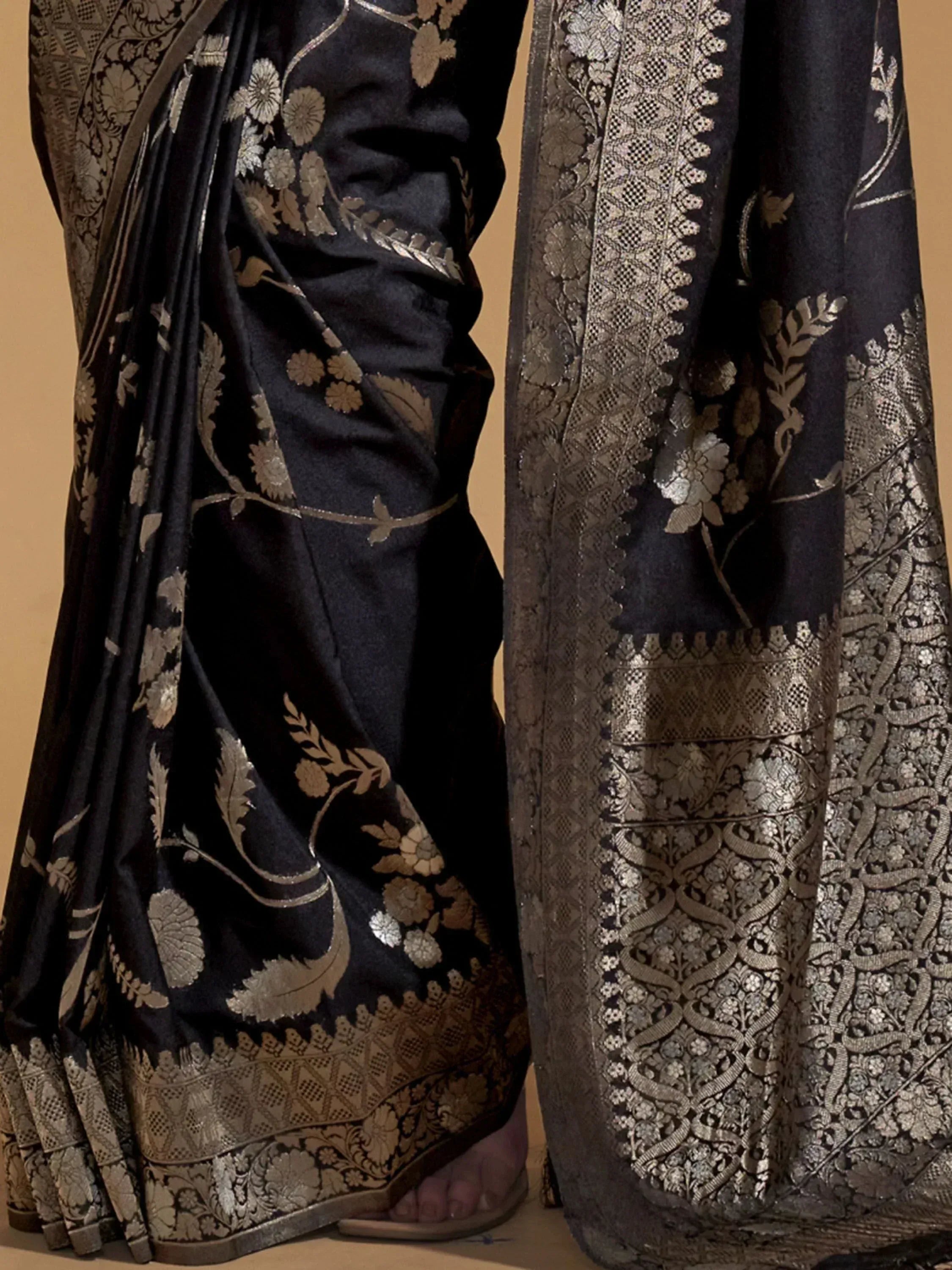 Black saree with gold floral embroidery and intricate border, Indian ethnic wear
