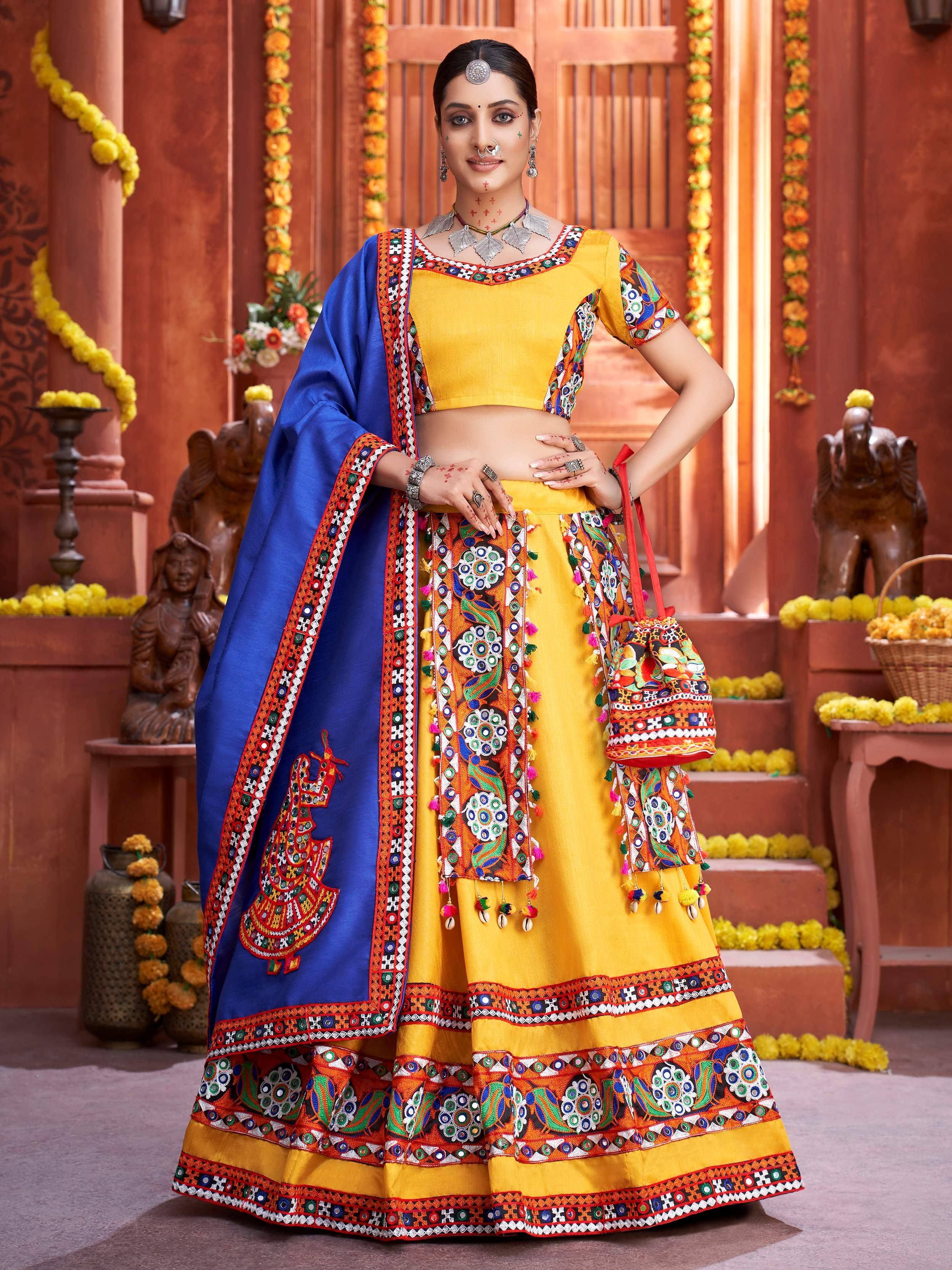 Yellow and blue embroidered ethnic lehenga choli with mirror work, perfect for Indian festivals and weddings