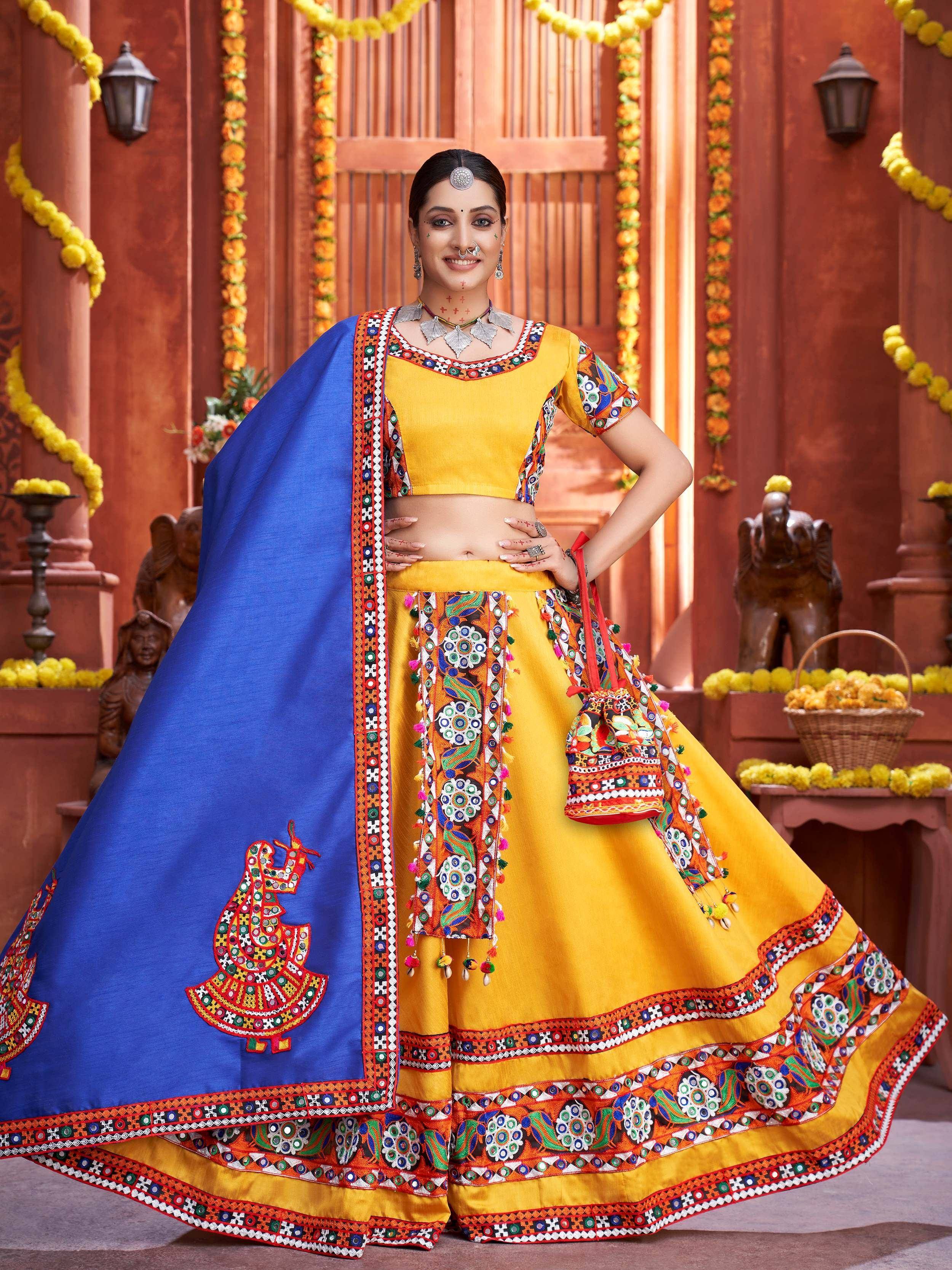 Yellow and blue embroidered lehenga choli with mirror work, perfect for Indian ethnic wear and festive occasions.