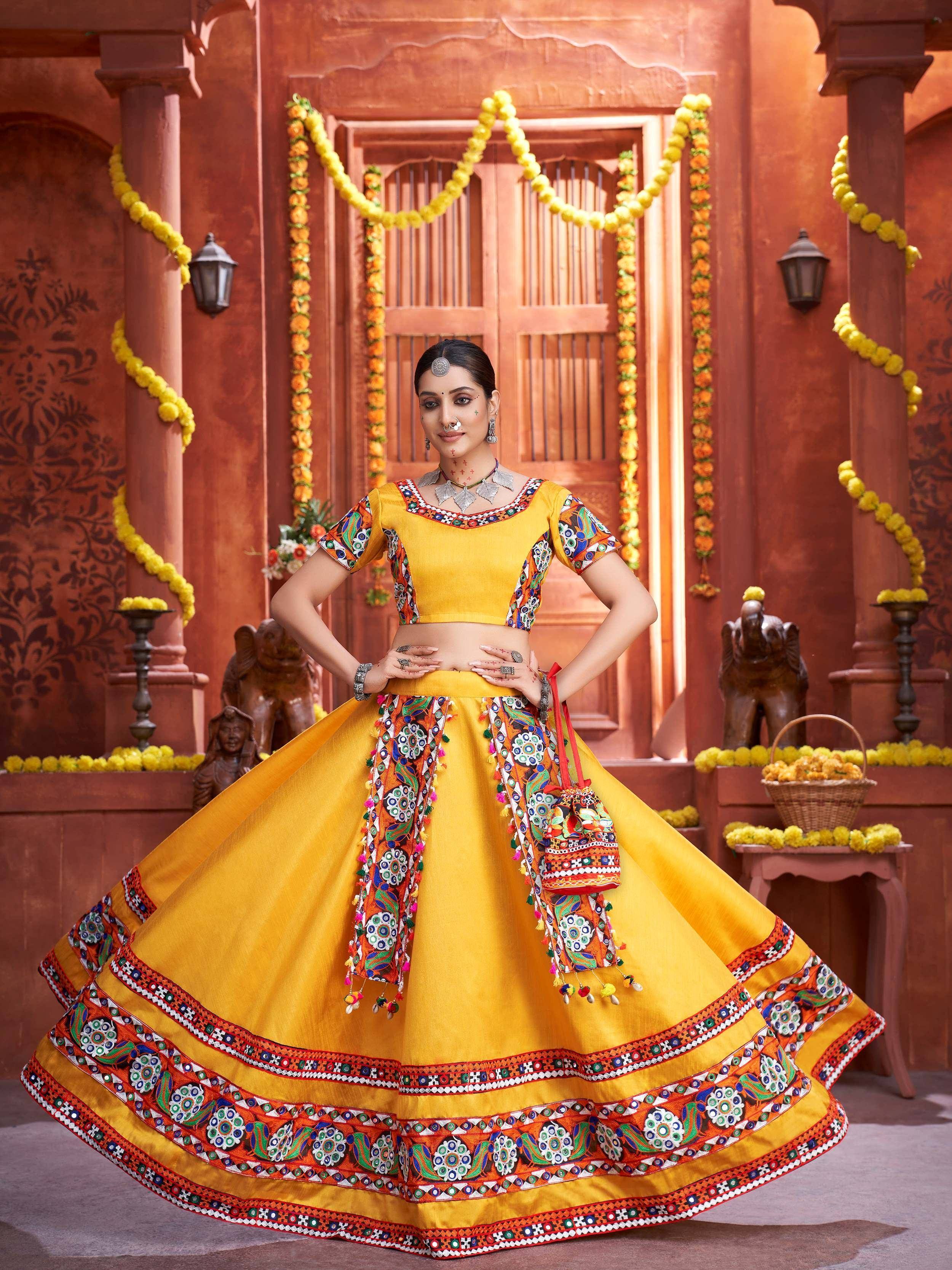 Vibrant yellow embroidered lehenga choli with mirror work, perfect for Indian ethnic wear and festive occasions.