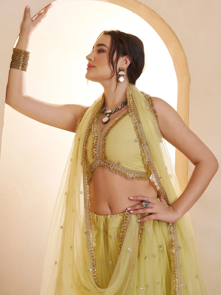 Wonderful Pastel Yellow Embroidered Net Haldi Wear Lehenga Choli