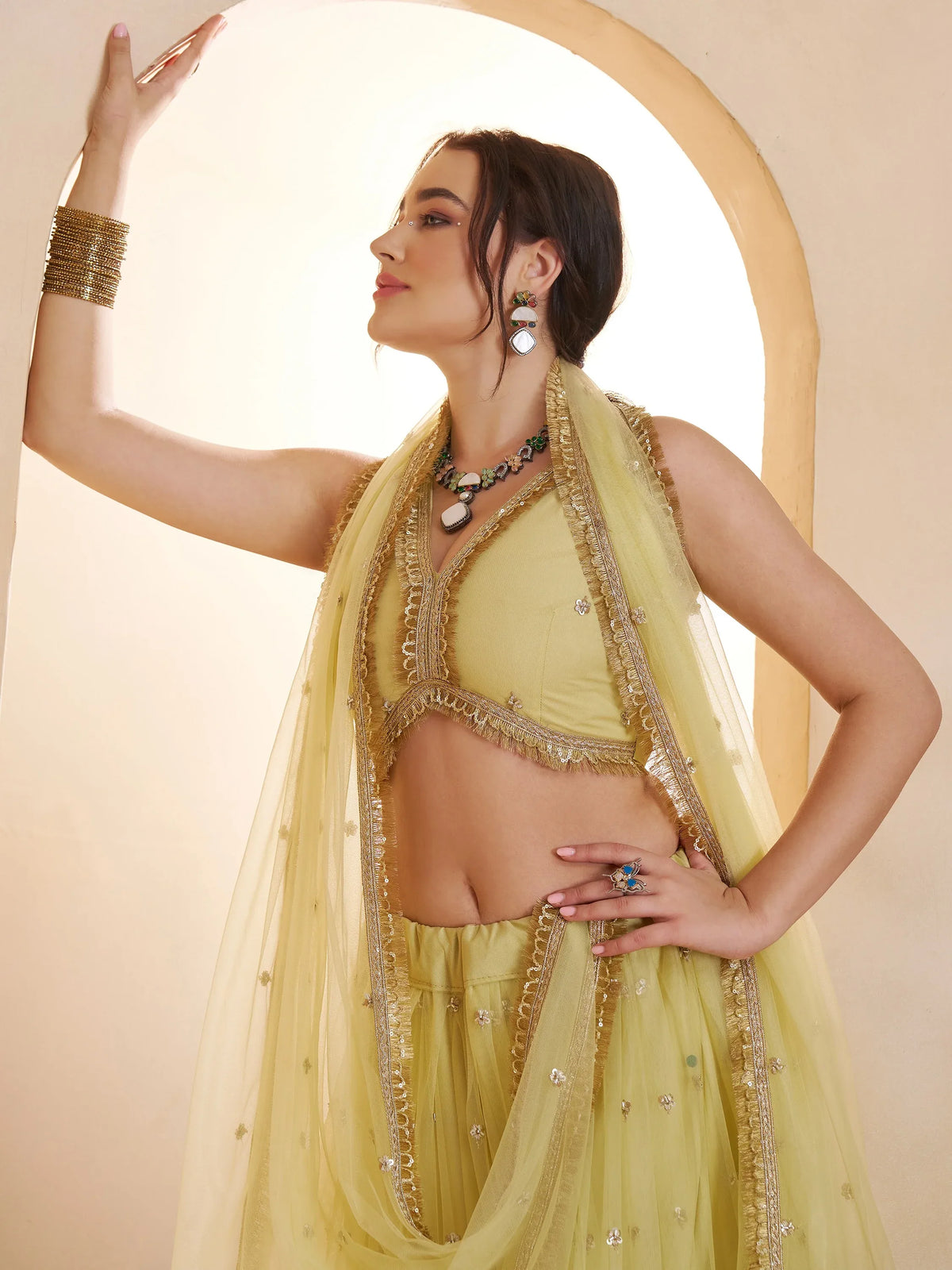 Wonderful Pastel Yellow Embroidered Net Haldi Wear Lehenga Choli