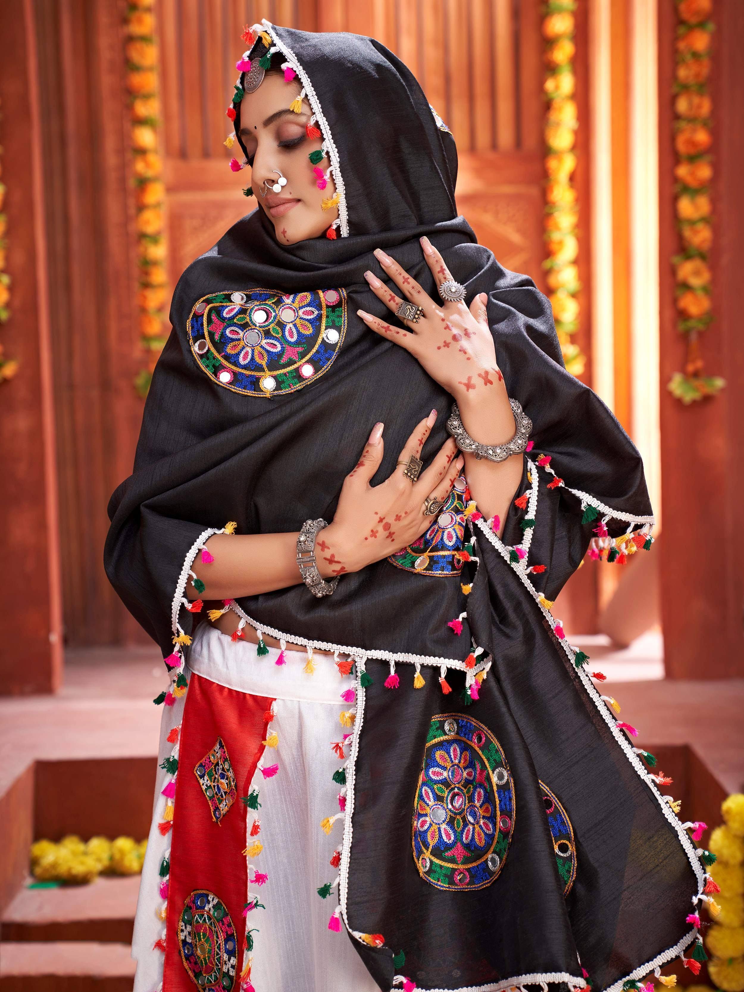 Black embroidered ethnic dupatta with mirror work, tassels, and traditional jewelry for Indian wear