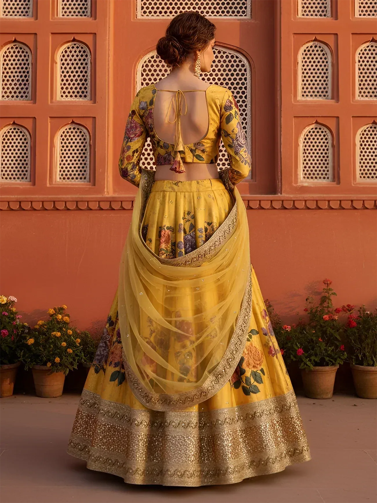 Yellow floral lehenga choli with back tie blouse, perfect for Indian weddings or festive occasions.