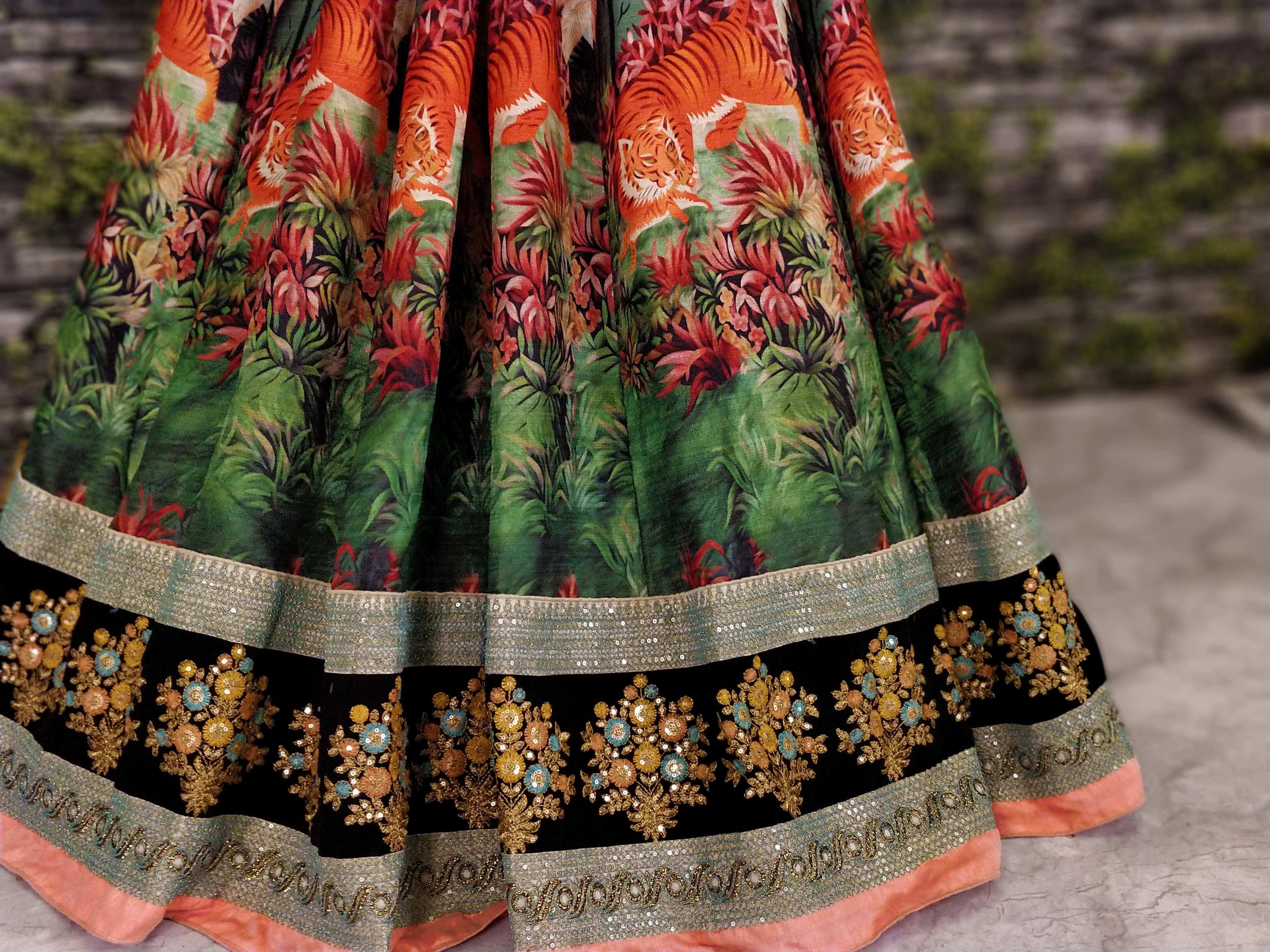 Tiger print ethnic lehenga with floral embroidery and sequin border, vibrant Indian wear