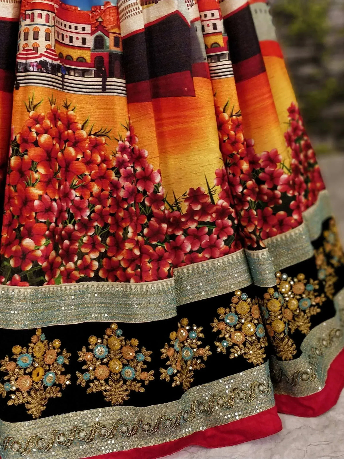 Designer lehenga choli with vibrant floral and castle print, sequin embroidery, and colorful borders