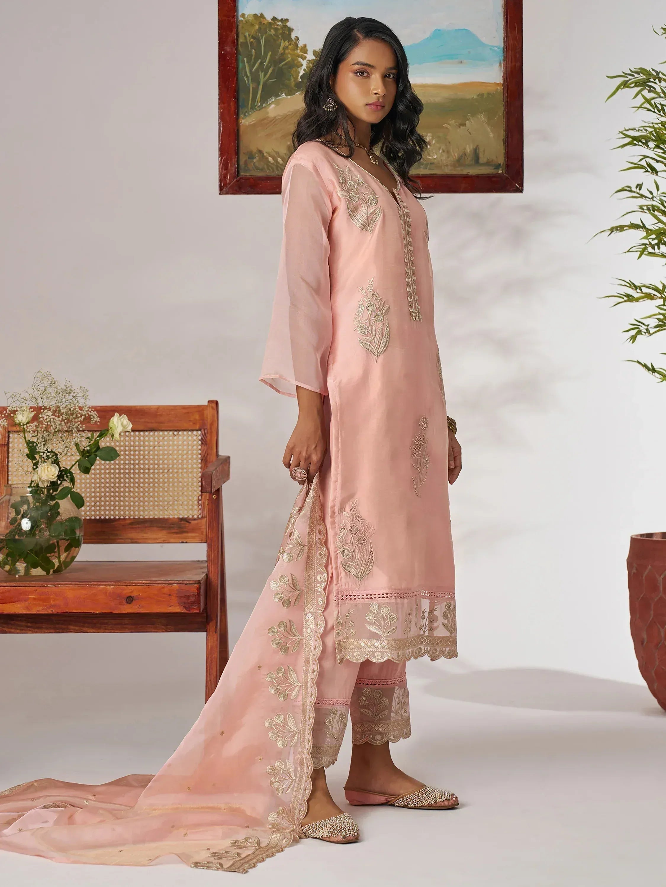 Pink embroidered salwar kameez with gold floral detailing, matching dupatta, and embellished flats for ethnic wear