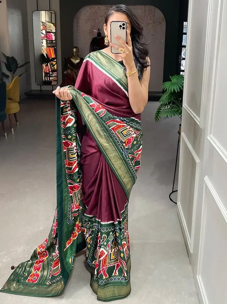 Enchanting Maroon Patola Printed Dola Silk Festival Wear Saree