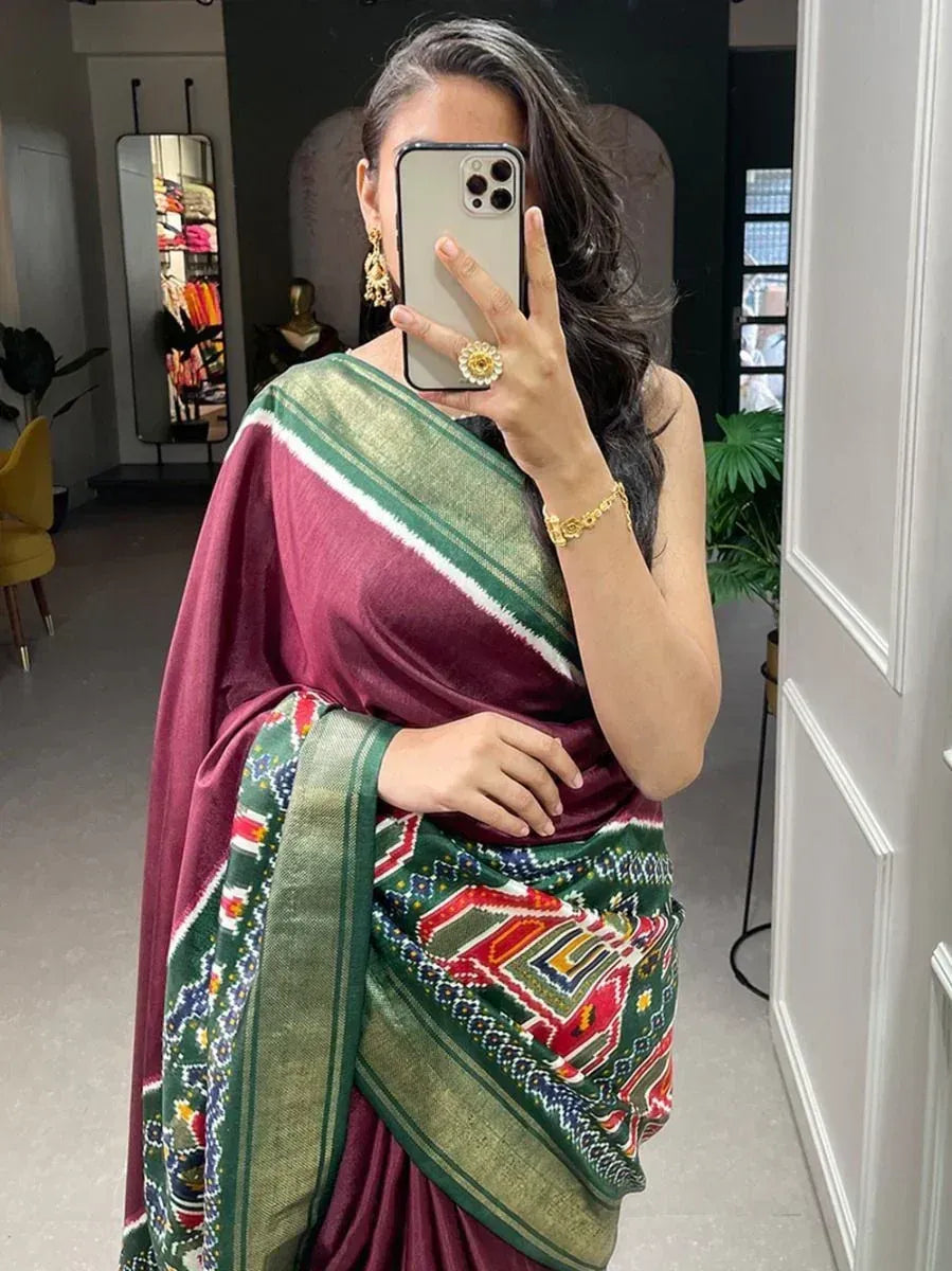 Enchanting Maroon Patola Printed Dola Silk Festival Wear Saree