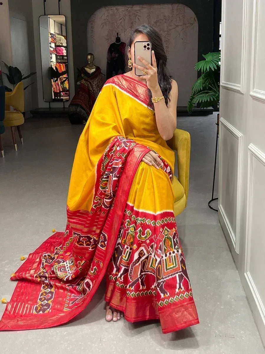 Yellow and red ethnic saree with elephant print, perfect for Indian occasions and festivals