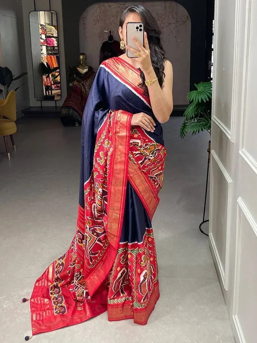 Elegant navy blue and red saree with intricate patterns, perfect for Indian ethnic wear