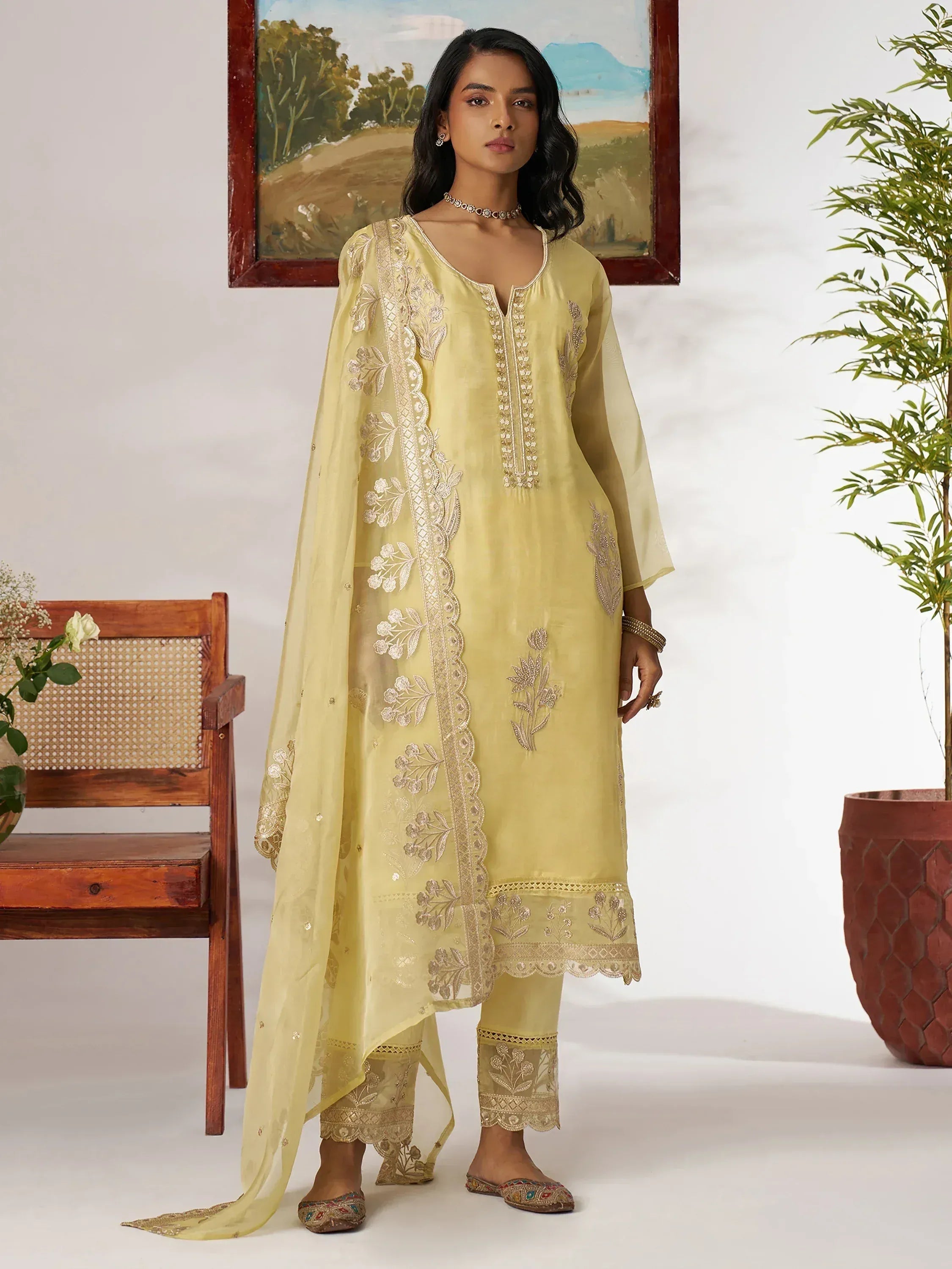 Yellow embroidered salwar kameez with floral detailing, perfect for ethnic occasions and Indian wear.