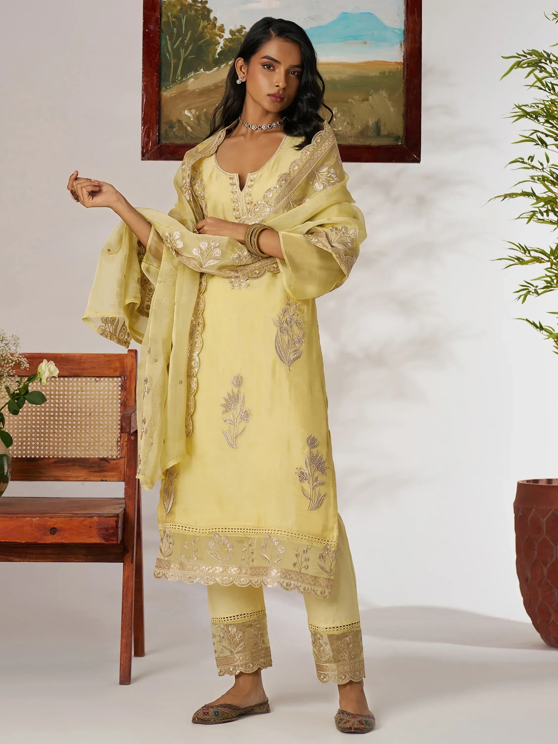 Yellow embroidered salwar kameez with floral detailing, perfect for Indian ethnic wear occasions
