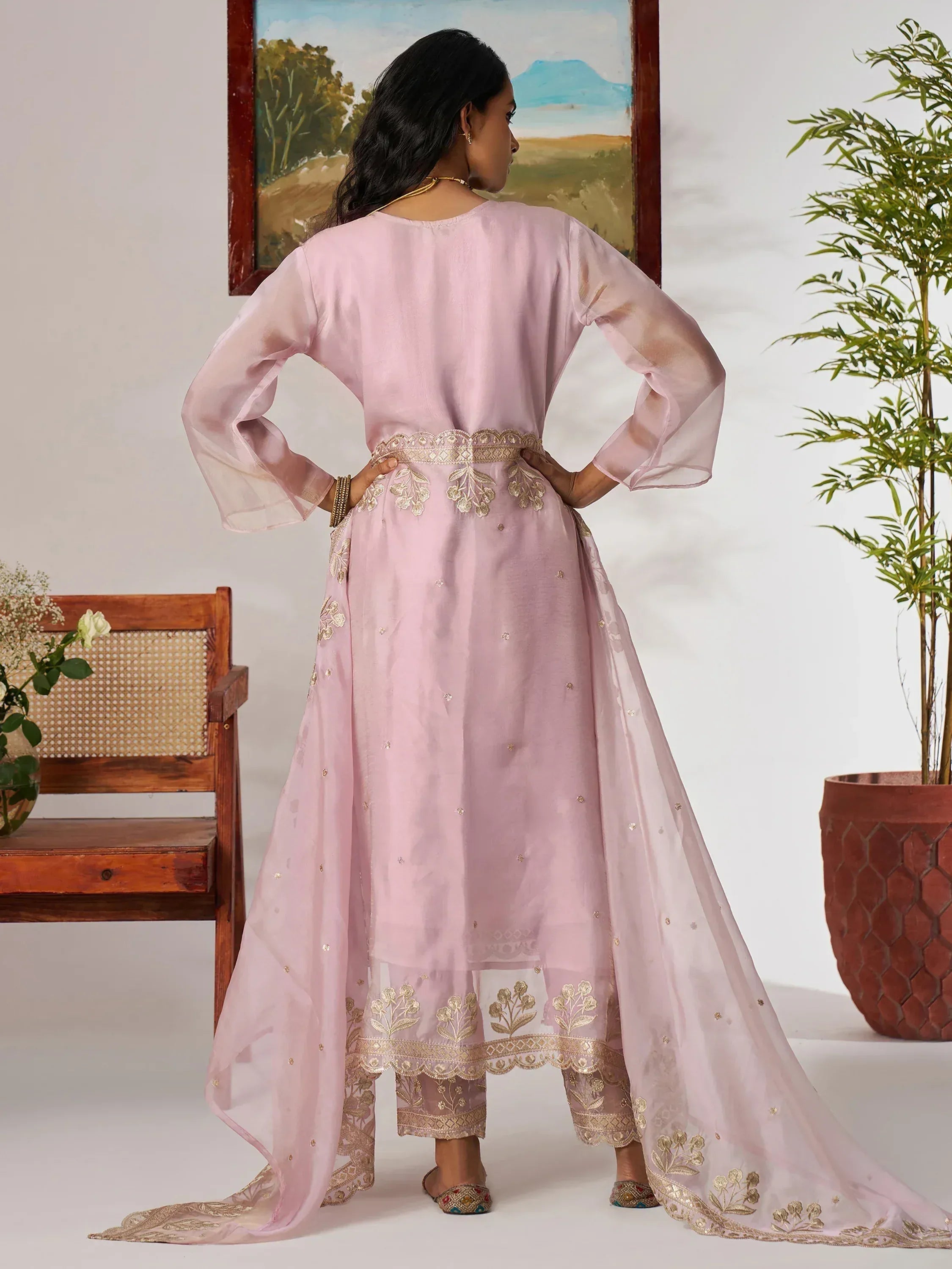 Pink embroidered ethnic gown with gold detailing, sheer sleeves, and matching pants for women