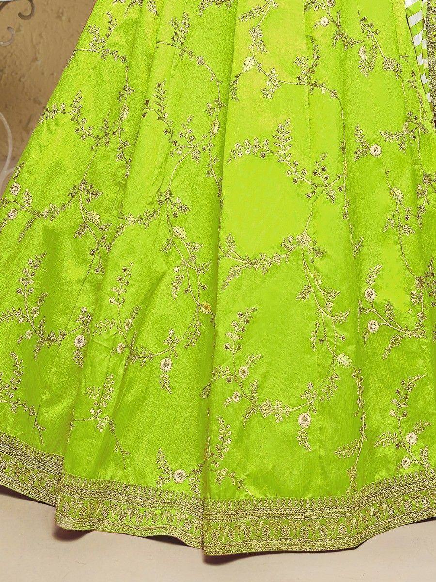 Vibrant lime green lehenga with gold floral embroidery and detailed border, perfect for Indian ethnic wear.