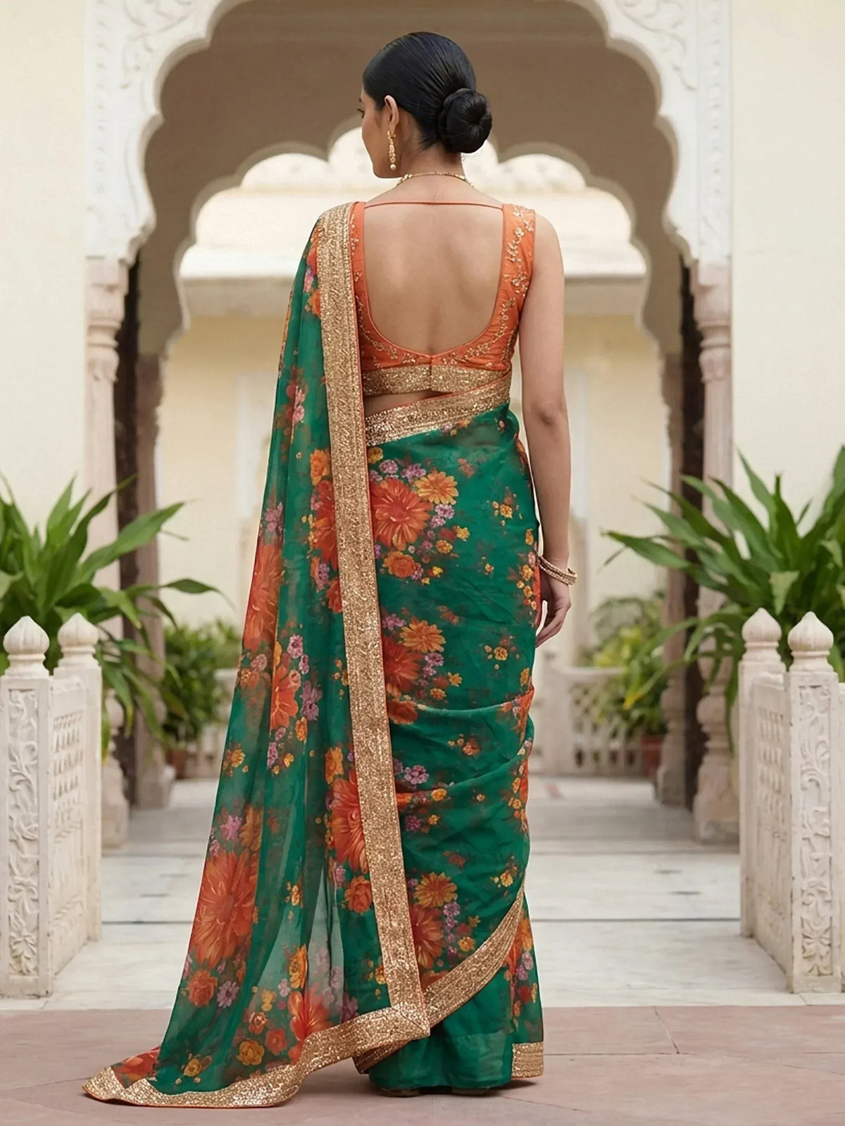 Green floral saree with gold border and orange blouse, ethnic Indian wear