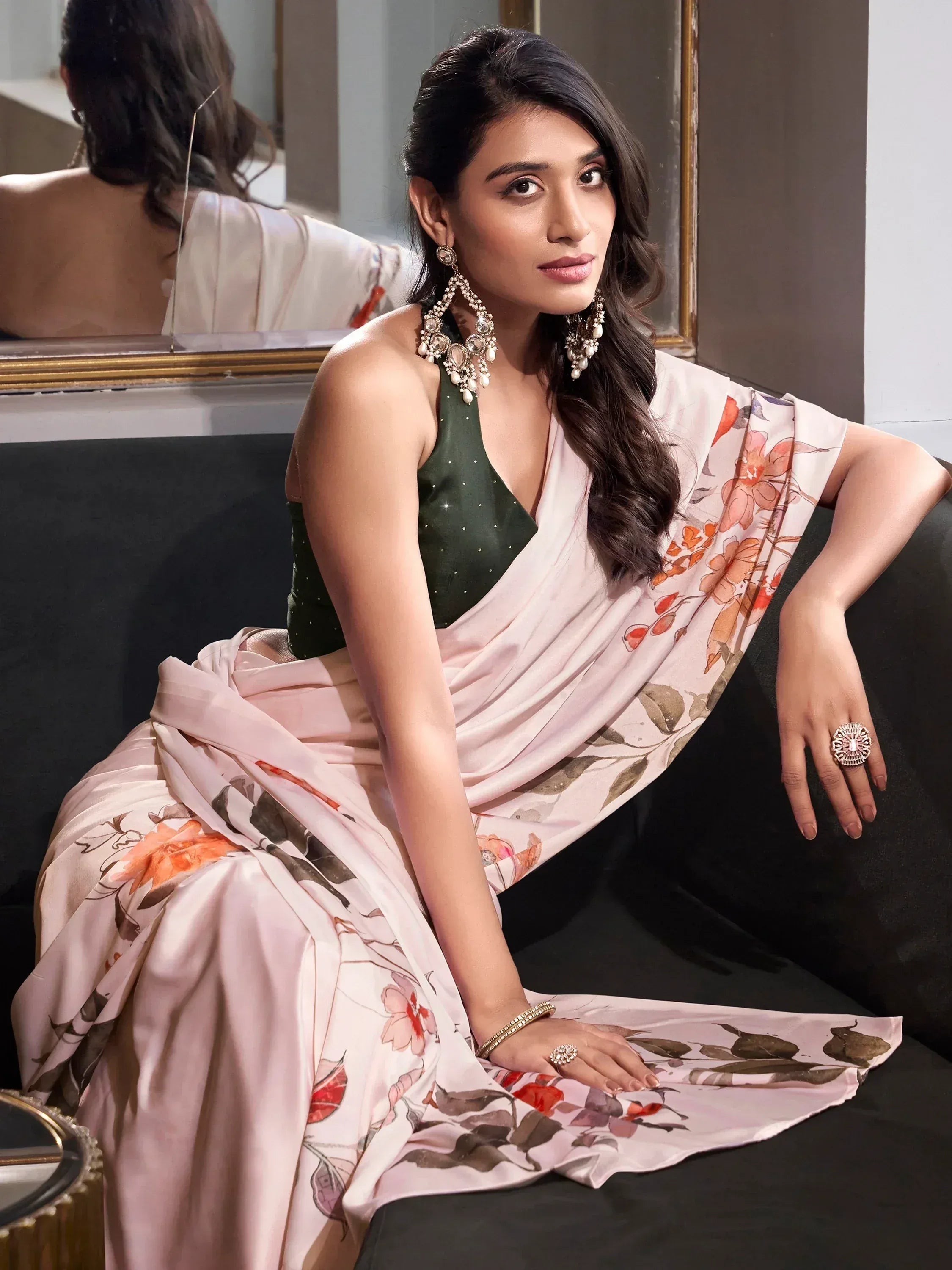 Woman in floral saree with green blouse, elegant ethnic wear for Indian occasions