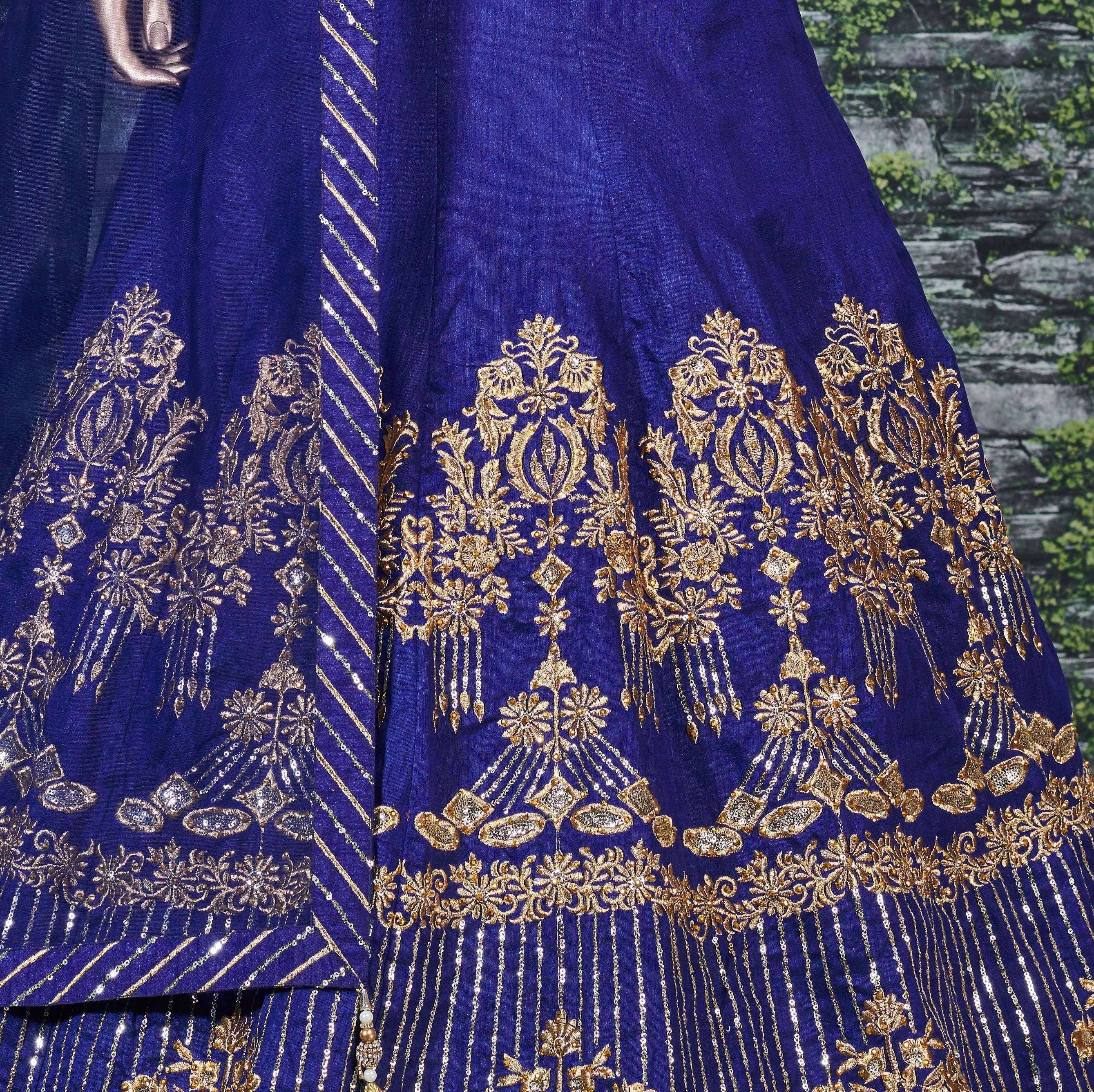 Royal blue lehenga with intricate gold embroidery and sequin detailing, perfect for Indian ethnic wear