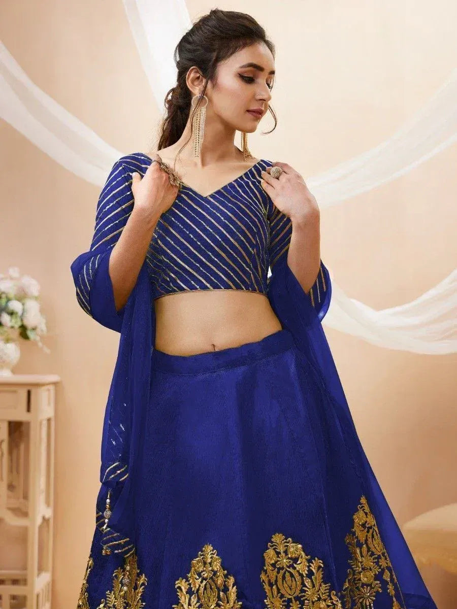 Royal blue lehenga choli with gold embroidery, perfect for Indian ethnic wear and festive occasions.