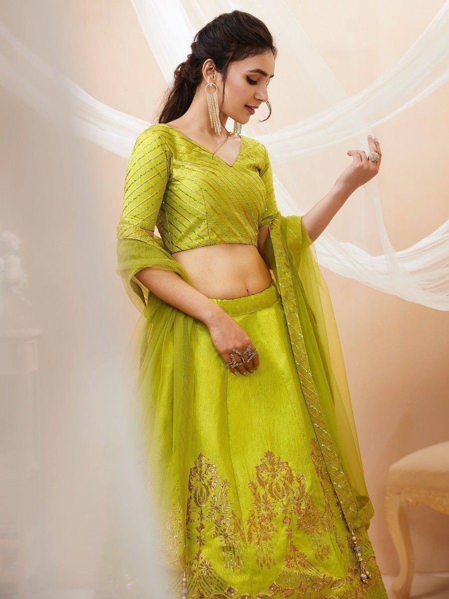 Lime green designer lehenga choli with gold embroidery, perfect for Indian ethnic wear occasions