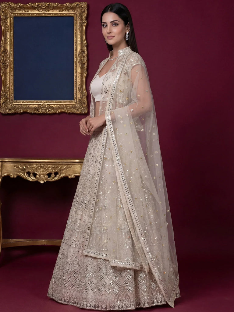 Beautiful Off-White Embroidered Net Party Wear Lehenga Choli