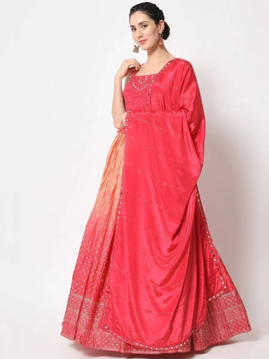 Red ethnic gown with mirror work and embroidery, perfect for Indian festive occasions