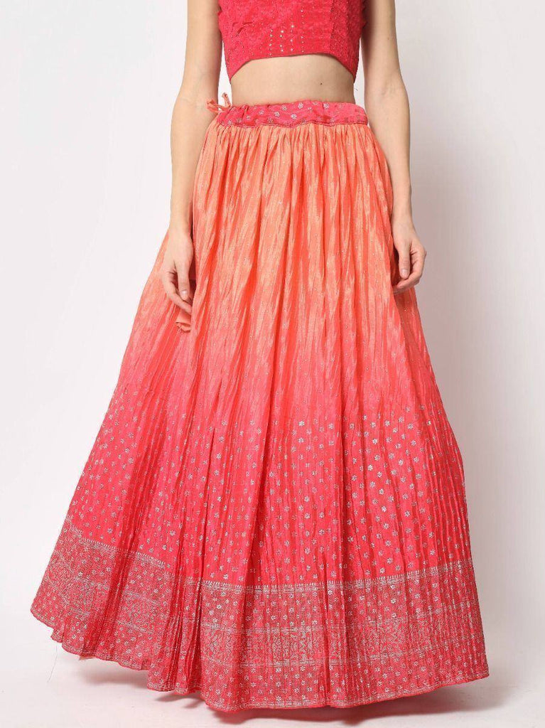 Coral pink pleated lehenga skirt with silver embroidery, paired with matching crop top for Indian ethnic wear