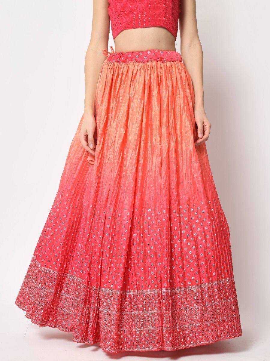 Coral pink pleated lehenga skirt with silver embroidery, paired with matching crop top for Indian ethnic wear