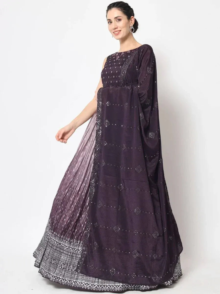 Purple embroidered ethnic gown with geometric patterns and pleated dupatta, perfect for Indian occasions.