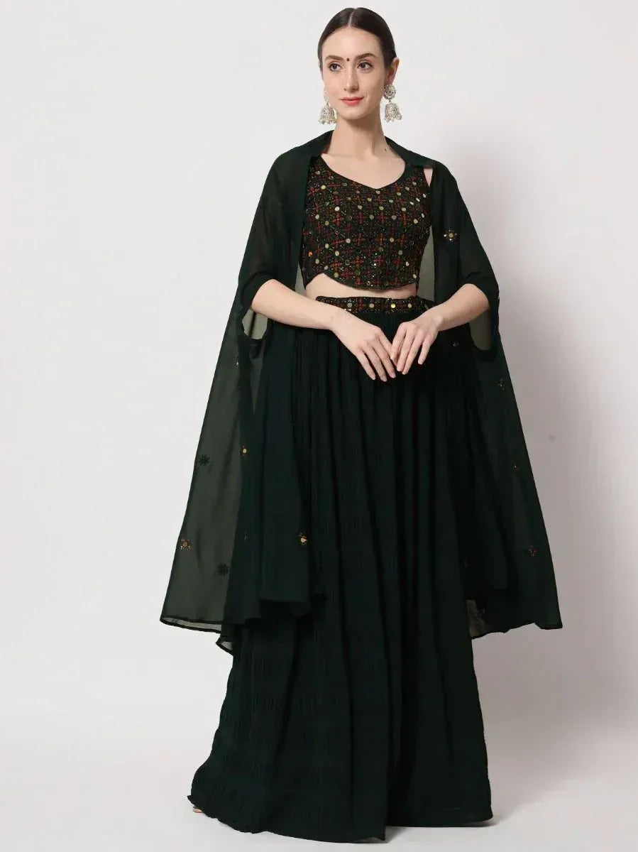 Dark green embroidered lehenga choli with sheer cape, perfect for Indian ethnic occasions