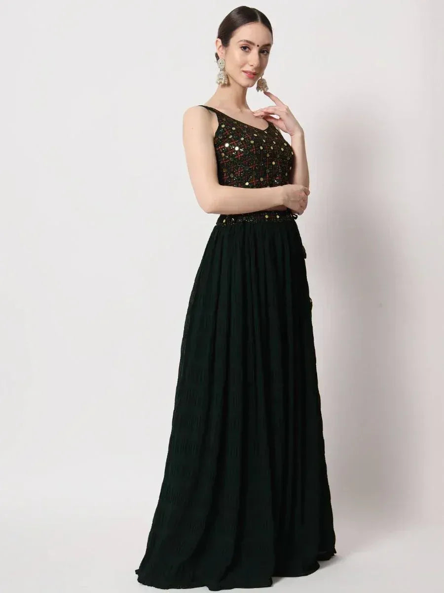 Black ethnic gown with sequin embellished top and pleated skirt, perfect for festive occasions