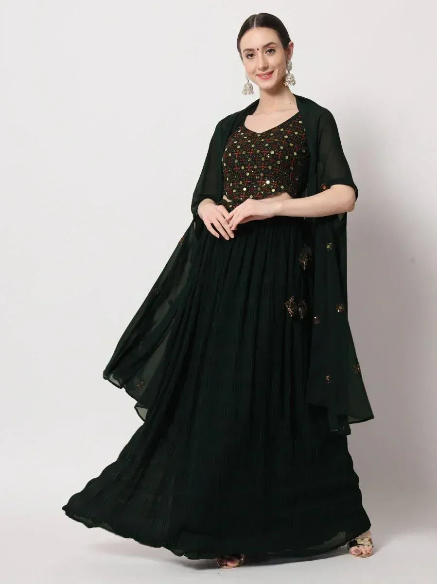 Dark green embroidered lehenga choli with sheer dupatta, perfect for Indian ethnic occasions