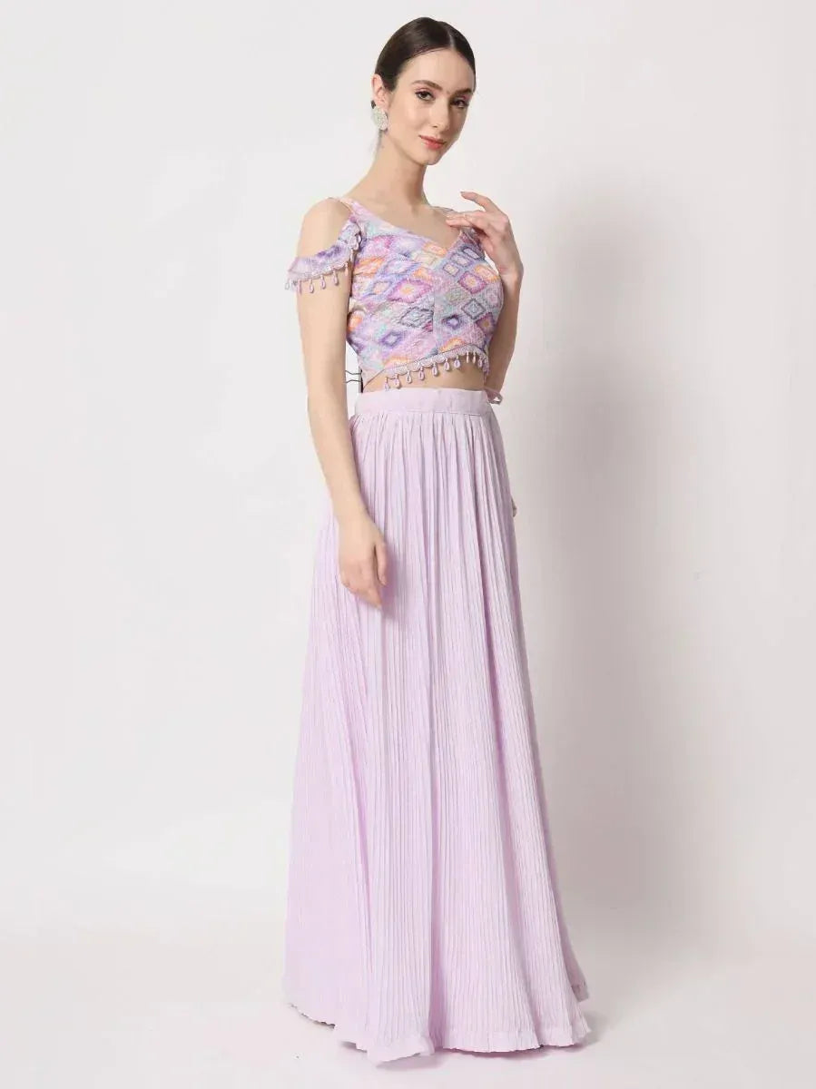 Lavender ethnic gown with printed crop top and pleated skirt, perfect for Indian occasions