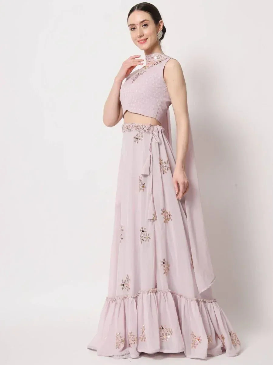 Pink embroidered lehenga choli with floral motifs and ruffled hem, perfect for Indian ethnic occasions