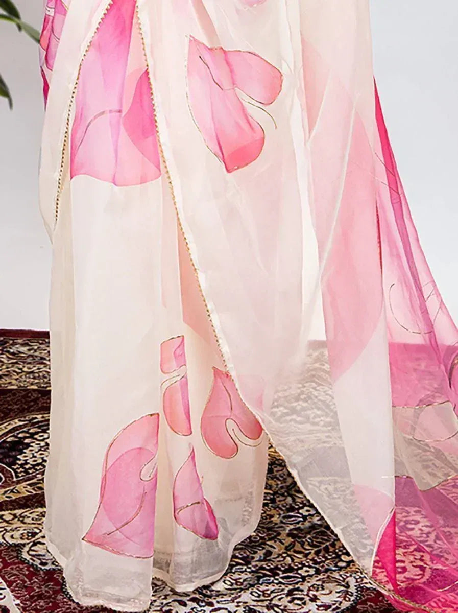 Pink floral printed sheer ethnic gown with gold trim, elegant Indian wear for women