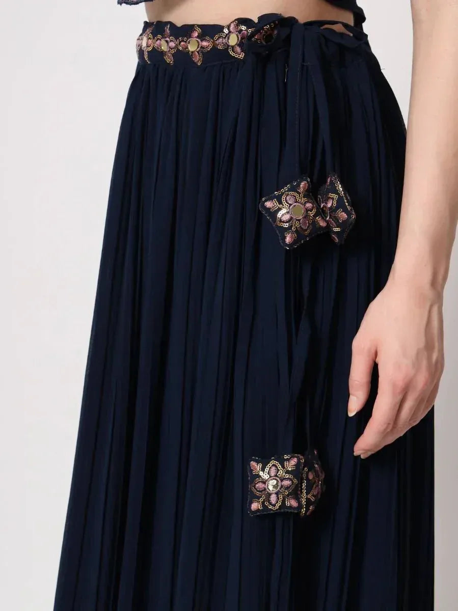 Navy blue pleated ethnic skirt with floral mirror embroidery and side ties, perfect for Indian wear