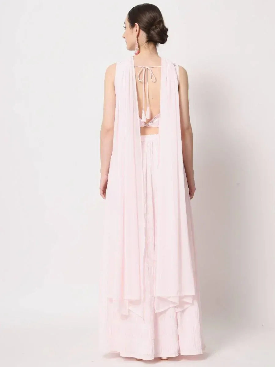 Pink ethnic gown with open back and tie detail, perfect for Indian festive wear