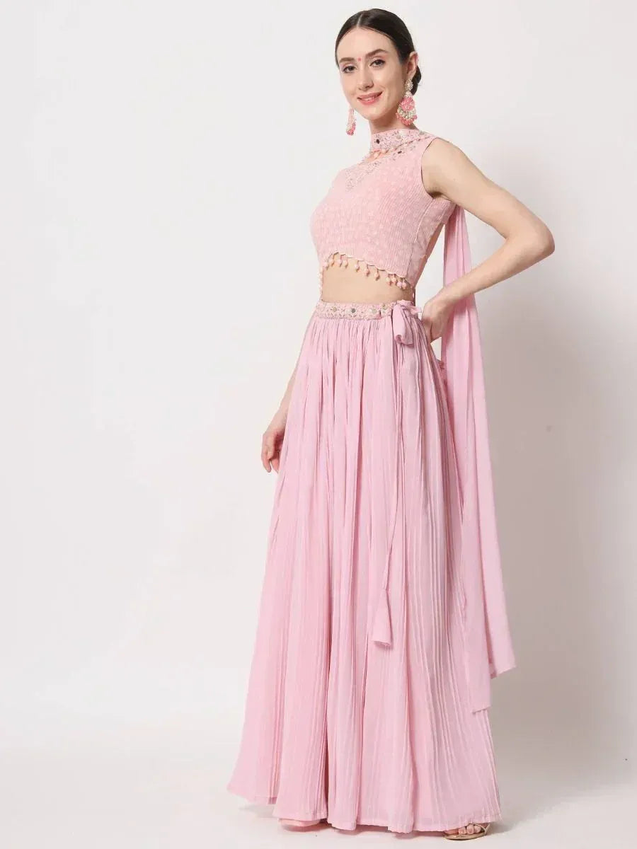 Pink designer lehenga choli with pleated skirt and embellished top, perfect for ethnic occasions