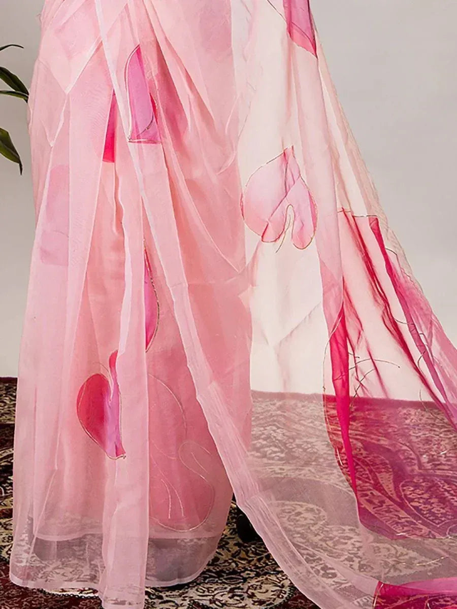 Pink floral printed sheer saree with delicate embroidery, perfect for ethnic occasions