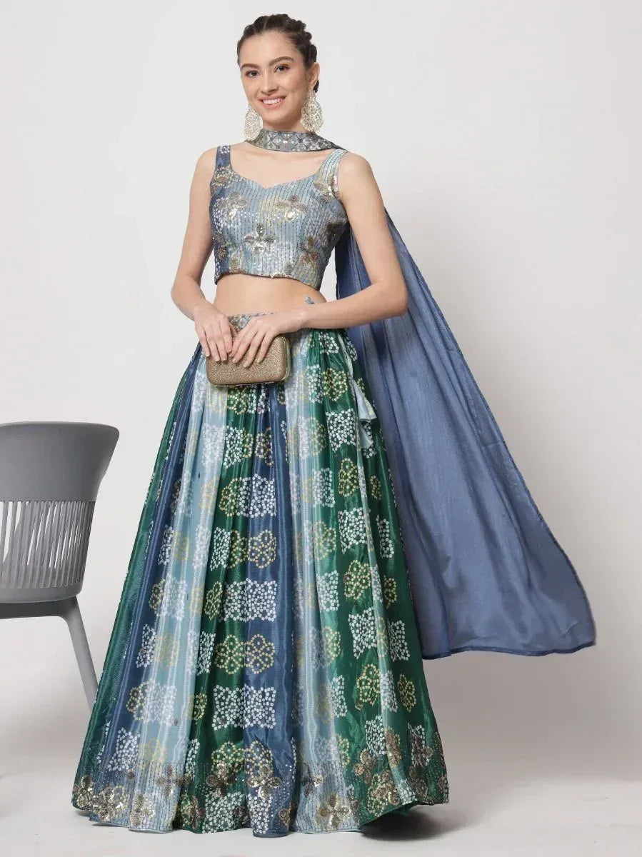 Blue and green designer lehenga choli with floral embroidery and dupatta, perfect for Indian ethnic occasions.