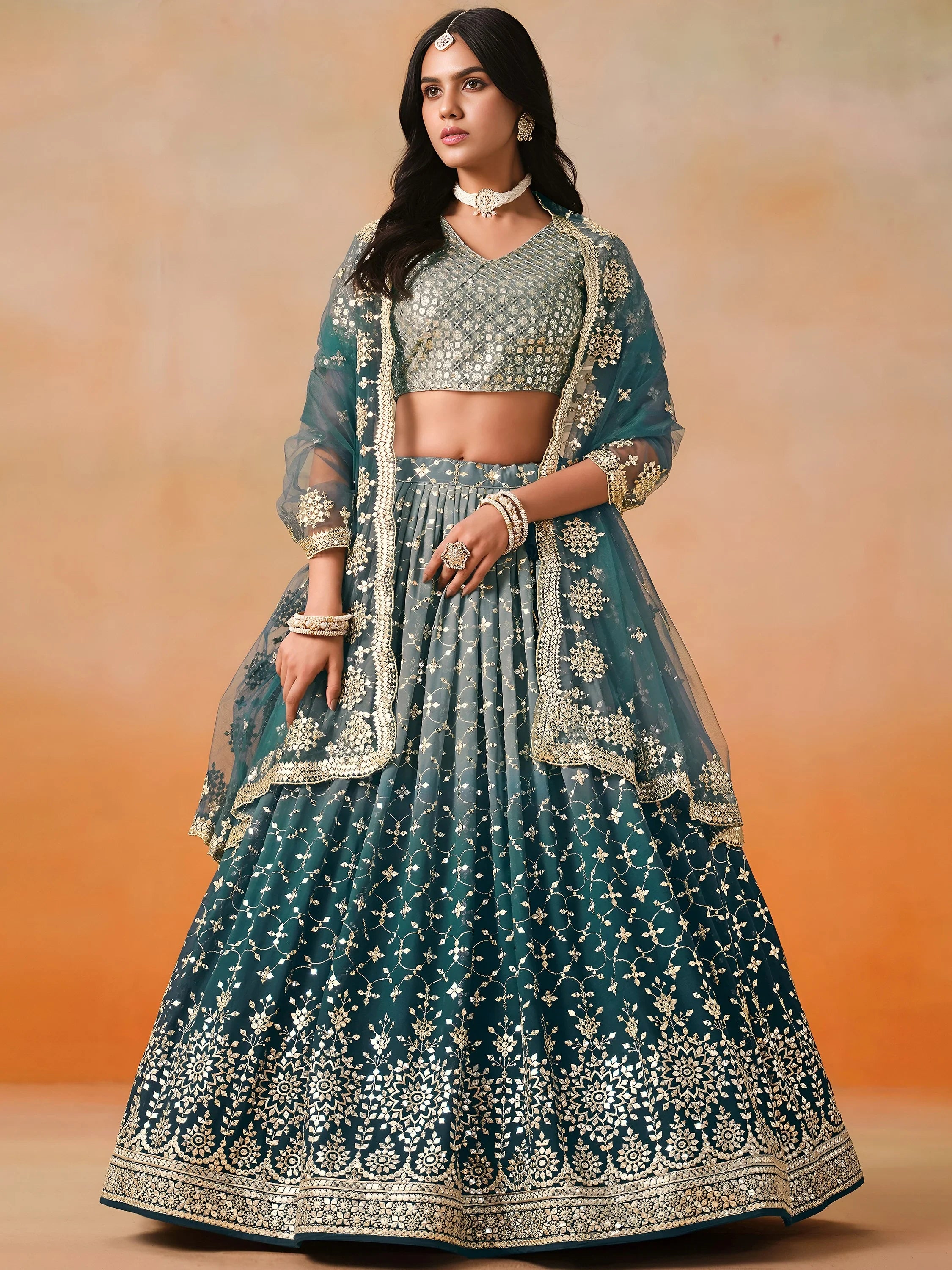 Glamorous Dove Blue Sequins Embroidered Georgette Lehenga Choli