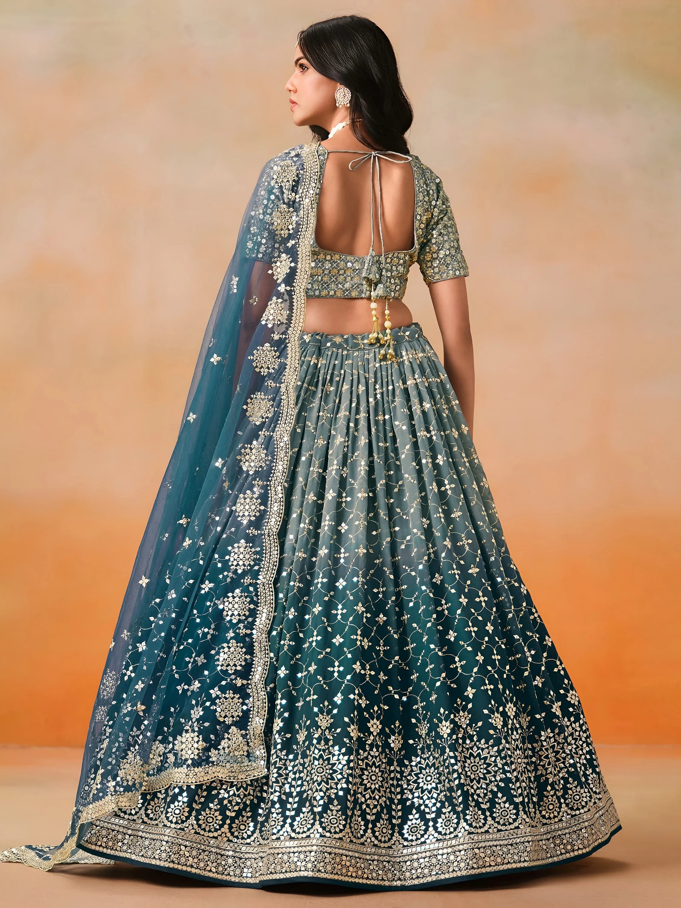 Glamorous Dove Blue Sequins Embroidered Georgette Lehenga Choli