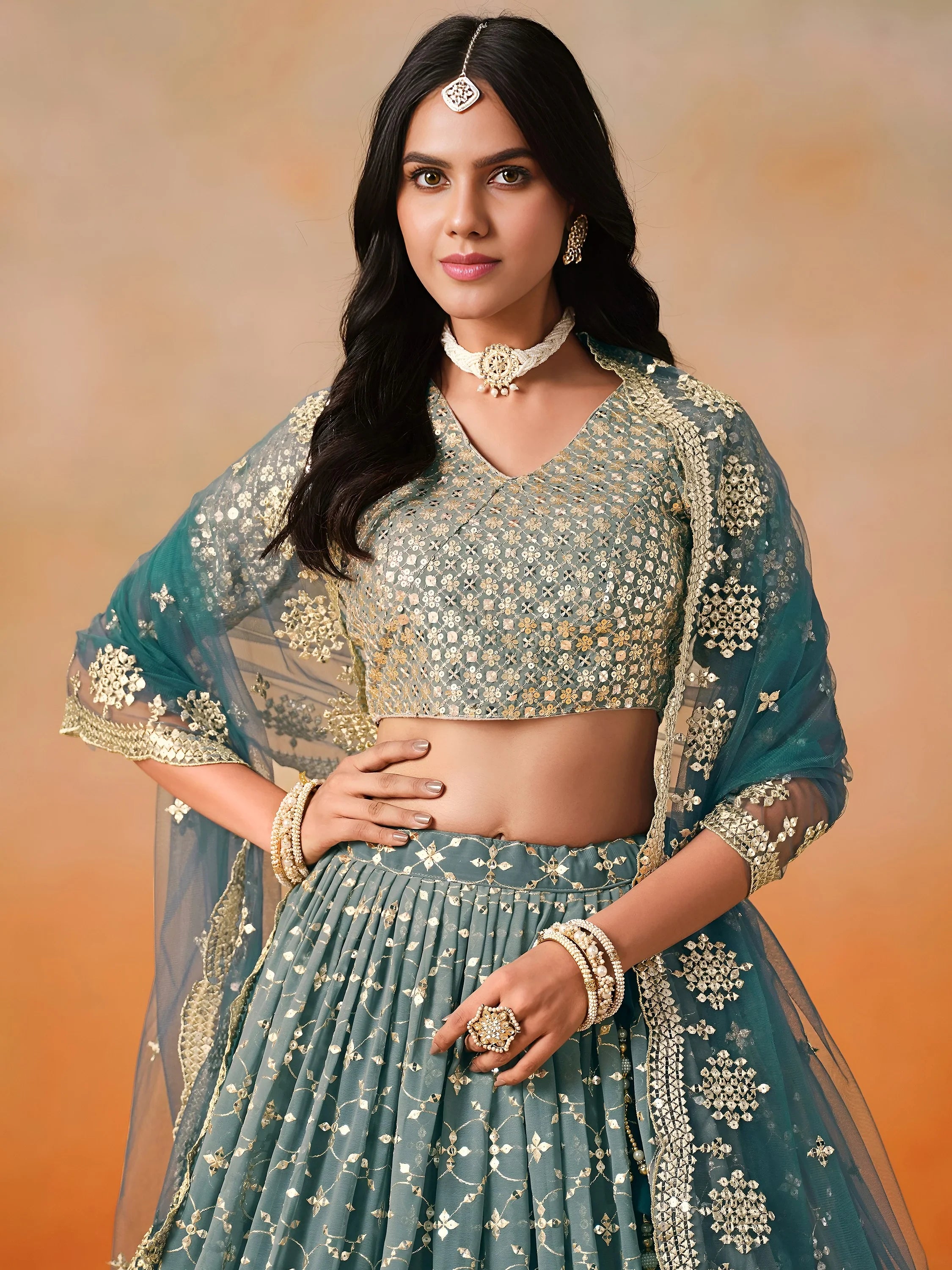 Glamorous Dove Blue Sequins Embroidered Georgette Lehenga Choli