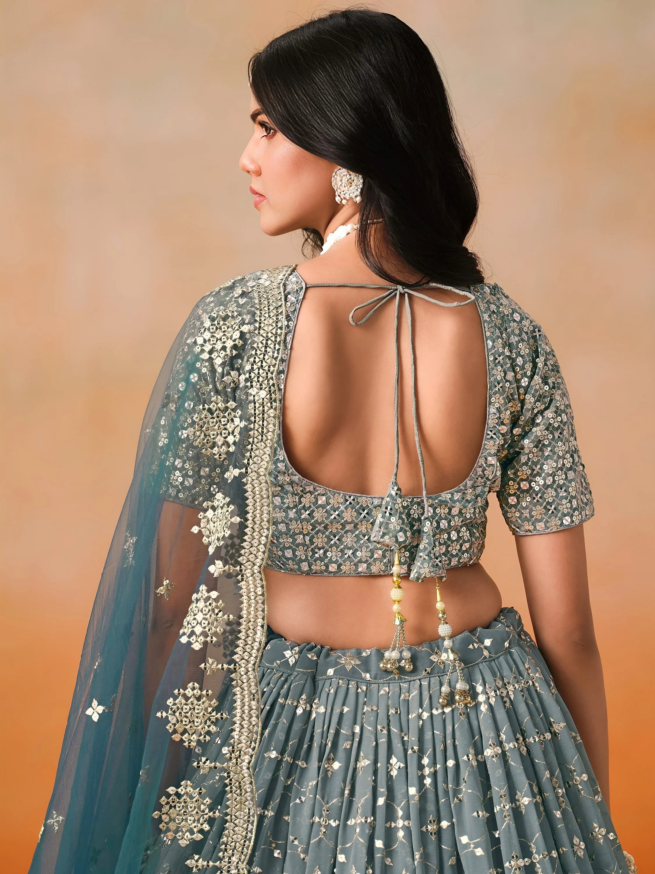 Glamorous Dove Blue Sequins Embroidered Georgette Lehenga Choli