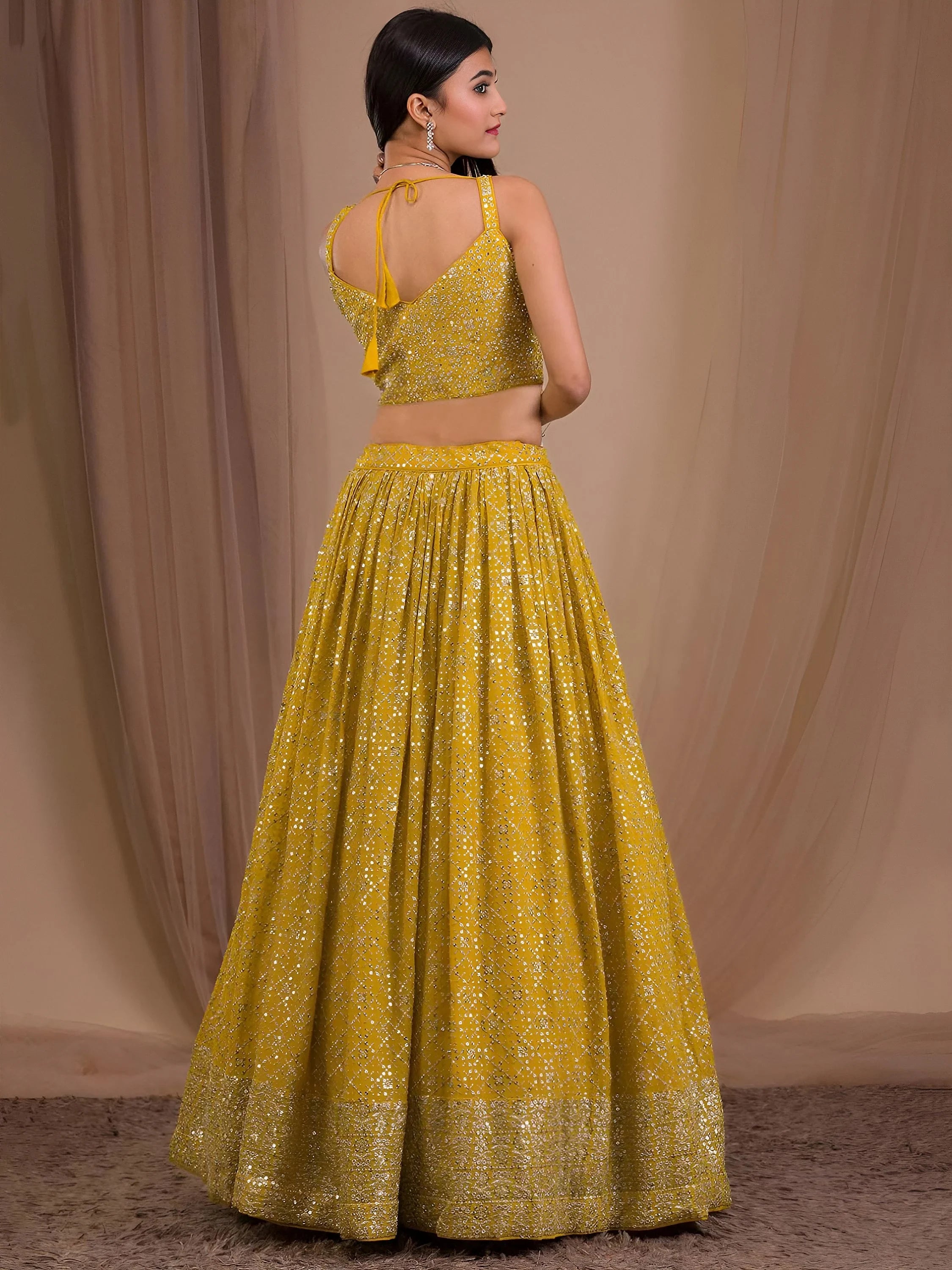Fascinating Yellow Sequins Georgette Haldi Wear Lehenga Choli