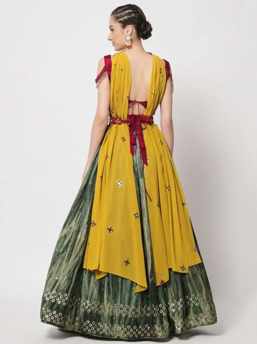 Yellow and green designer lehenga choli with backless blouse and floral embroidery