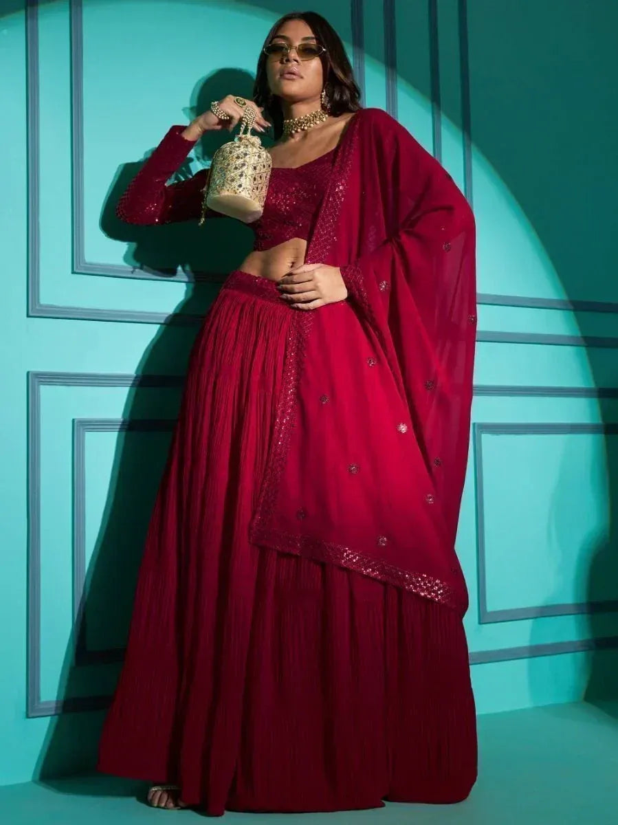 Burgundy designer lehenga choli with sequin top, pleated skirt, and sheer dupatta for ethnic wear