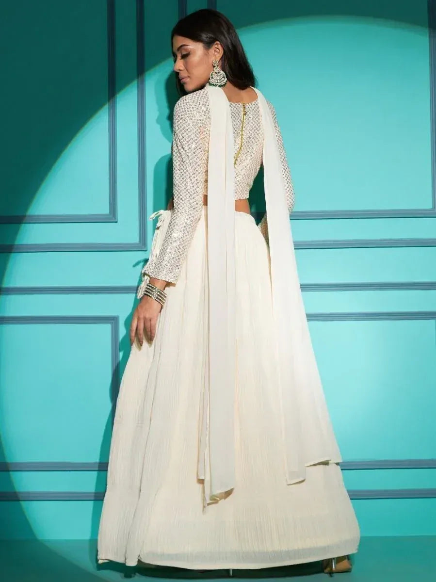 Elegant white embroidered lehenga choli with sheer dupatta, perfect for Indian ethnic wear occasions.