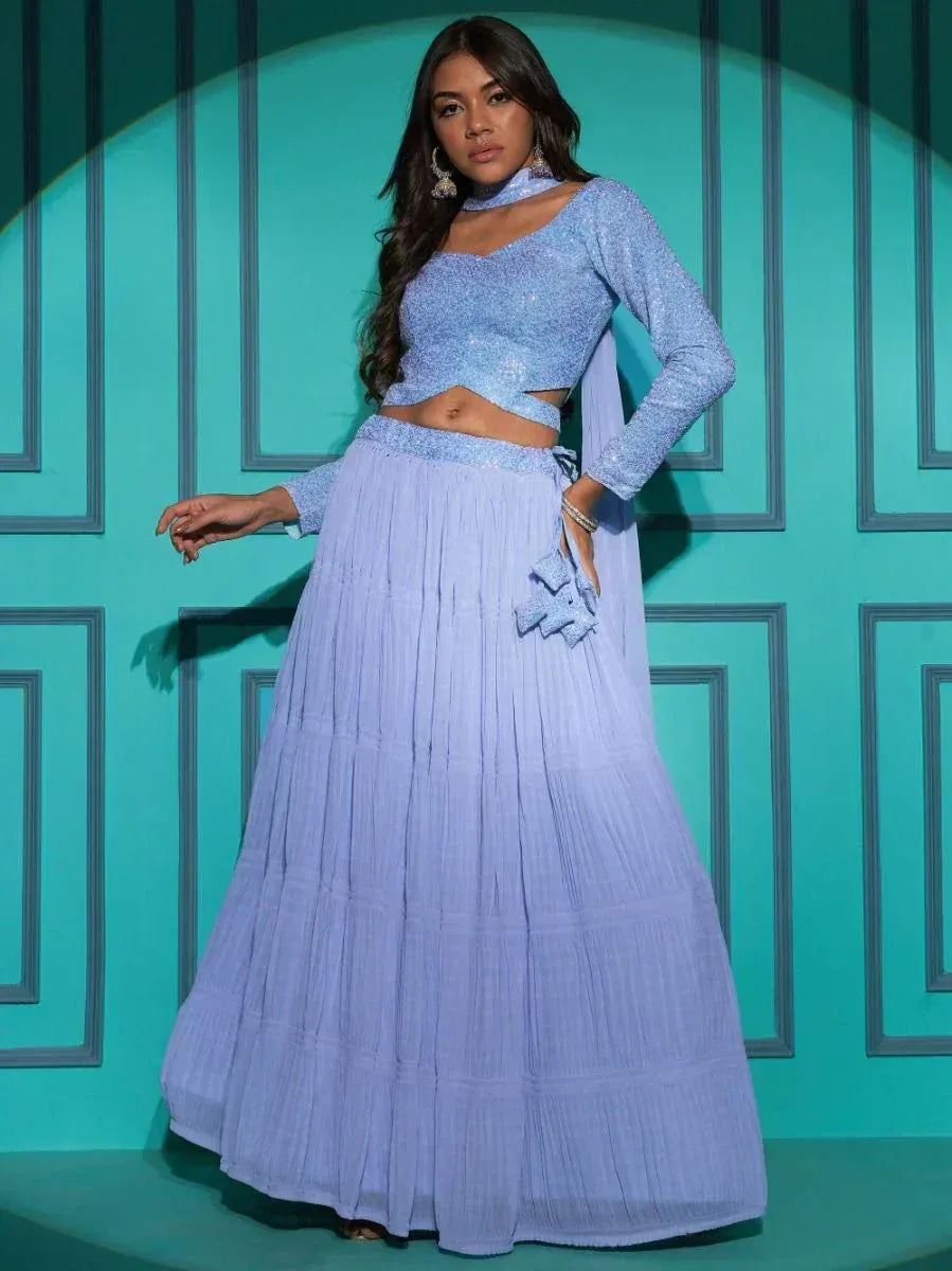 Light blue designer lehenga choli with sequin top and pleated skirt, perfect for Indian ethnic wear occasions