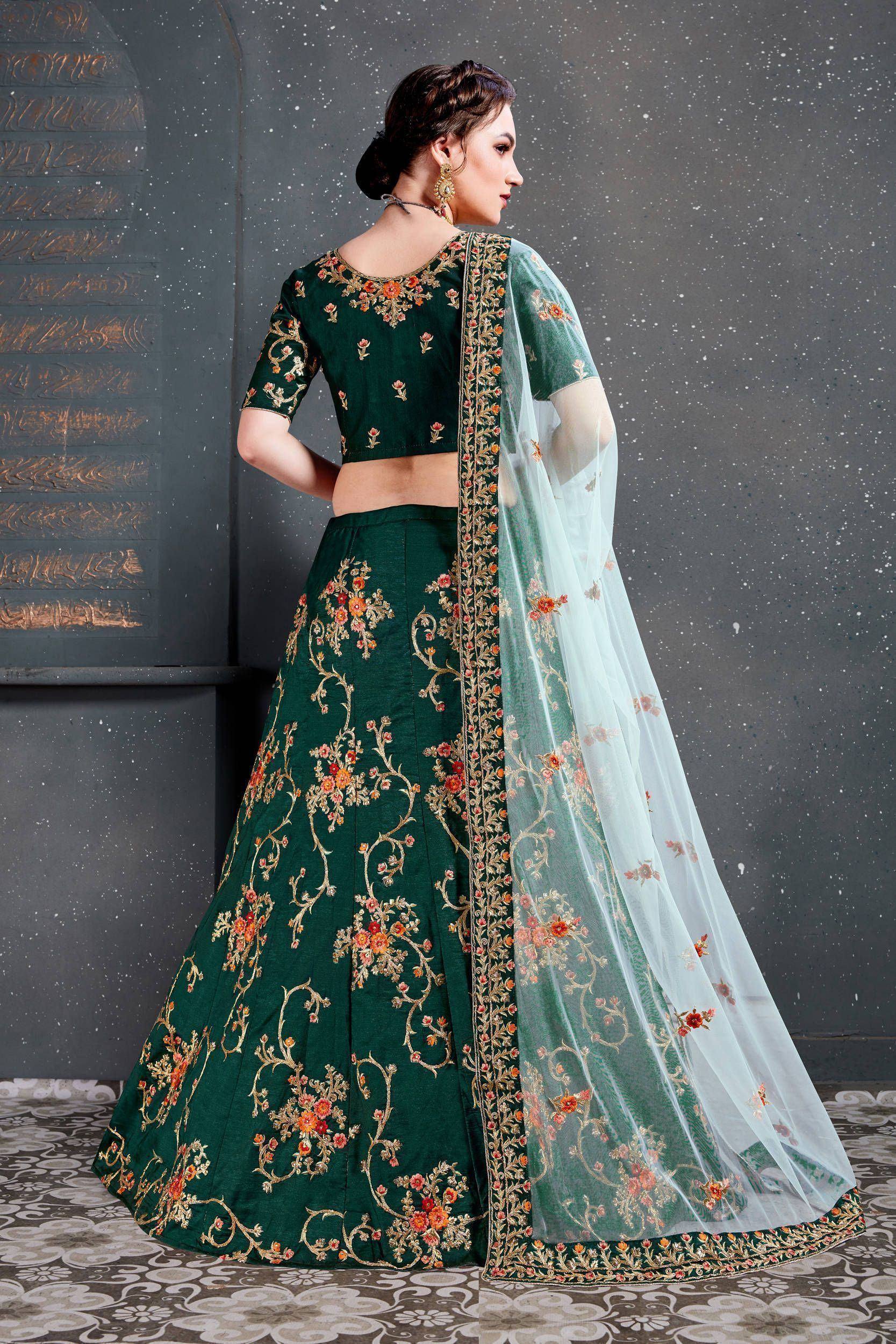 Emerald green embroidered lehenga choli with floral motifs and sheer dupatta, perfect for Indian ethnic occasions.